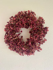 Burgundy winterkrans – warme elegantie voor binnen en buiten